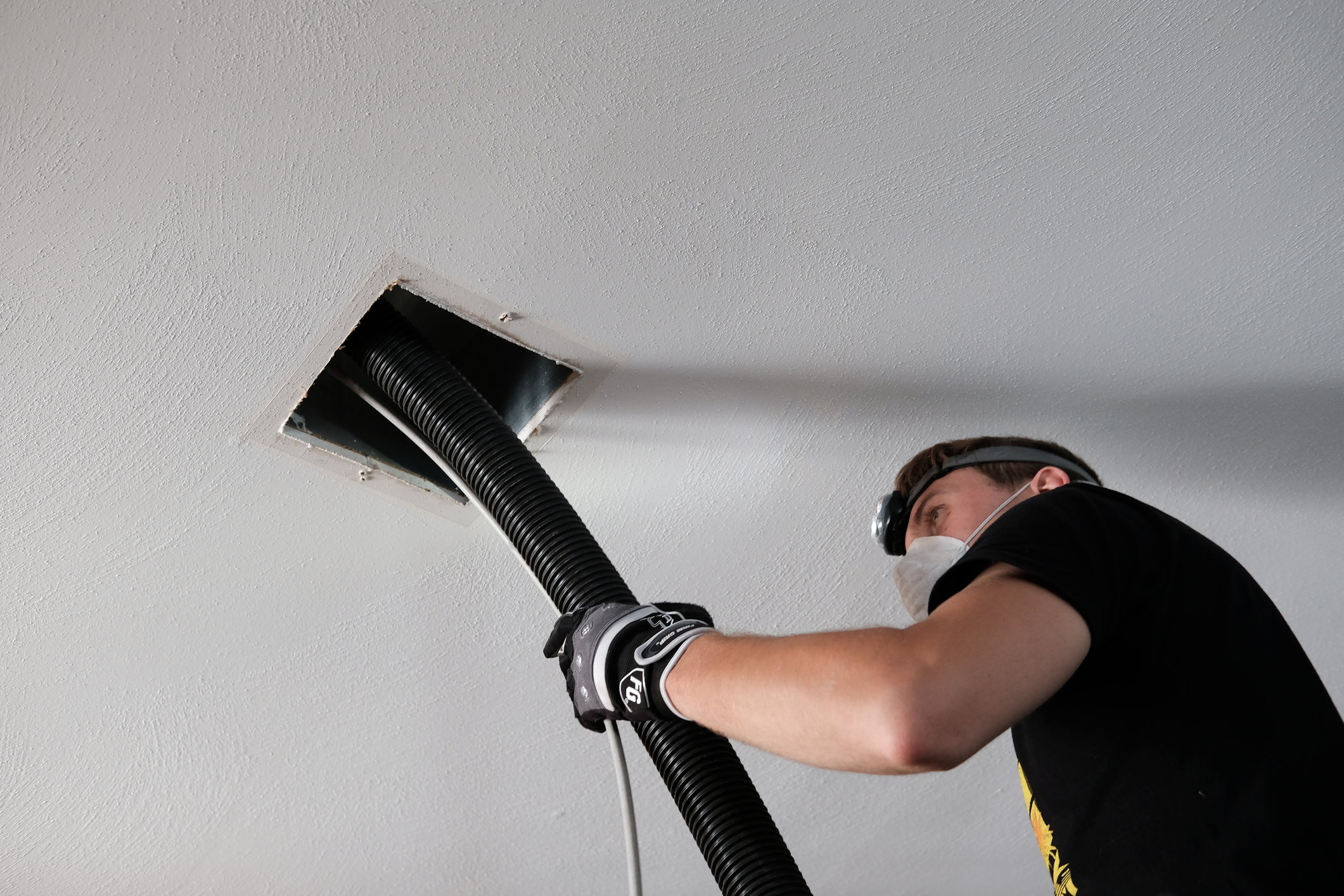 air-duct-cleaning-drill-ductwork-man-hvac-122152534.jpg